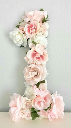 the letter i is made out of paper flowers