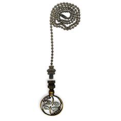 a long necklace with an ornate pendant hanging from it's center beaded chain