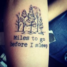 a tattoo saying miles to go before i sleep on someone's left arm with trees in the background