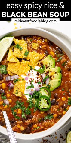 a white bowl filled with black bean soup and topped with tortilla chips