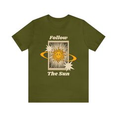 Follow The Sun Tshirt! The Follow the Sun T-Shirt is perfect for those who love to chase the sun and live life to the fullest. Made from soft and breathable cotton, this t-shirt features a cool graphic design that will make you stand out from the crowd. Whether you're hitting the beach, going on a road trip, or just hanging out with friends, this t-shirt is the perfect addition to your wardrobe. Features: - Made from soft and breathable cotton - Cool graphic design - Available in multiple sizes - Machine washable Benefits: - Comfortable to wear all day long - Makes a statement with its unique design - Perfect for any casual occasion - Easy to care for and maintain This classic unisex jersey short-sleeve tee fits like a well-loved favorite. Soft cotton and quality print make users fall in l Spicy Image, Astrology Shirt, Follow The Sun, Chasing The Sun, Sun Shirt, Retro Gift, Design Graphique, Tarot Card, Unisex Shorts