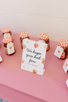 there is a sign on the table that says we hope you had fun with strawberry jam