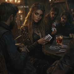 a group of people sitting around a table with cards and drinks in front of them