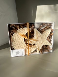 a star shaped cookie in a clear box