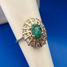 * Fabulous 18K Yellow Gold Oval Emerald Round Diamond Anniversary Cocktail Ring * Ring Size: 4.75 * Top of ring measures: 5/8" x 1/2" * Height: 3/8" * Oval Emerald total carat weight: approximately .85 tcw * Round Diamond total carat weight: approximately .70 tcw * Ring weight: 5.5 tgw * Marked: 18K * Condition: Great * G1720    Exported By ExportYourStore :) Luxury Oval Cluster Ring In Yellow Gold, Heirloom Style Oval Diamond Ring With 17 Jewels, Heirloom Oval Diamond Ring With 17 Jewels, Luxury Oval Hallmarked Emerald Ring, Luxury Oval Cabochon 14k Stamped Rings, Luxury 14k Stamped Oval Cabochon Ring, Luxury Stamped 14k Oval Cabochon Ring, Luxury Oval Emerald Cluster Ring, Yellow Gold Diamond Ring With Oval Cabochon