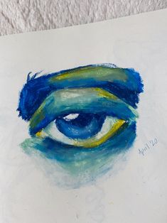 an eye painted in blue and yellow on white paper