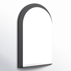 an arch shaped mirror hanging on the wall