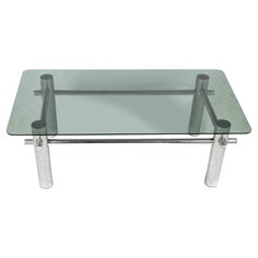 a glass table with two metal legs