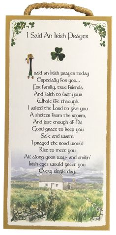 an irish prayer hanging from a rope with shamrocks on the front and back of it