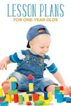 a baby sitting on the floor playing with blocks and building toys for one year olds