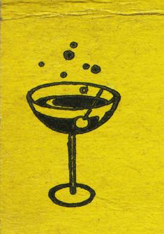 a yellow piece of paper with a drawing of a martini glass and olives in it