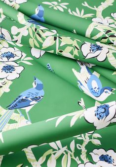 blue birds and flowers on green background