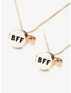 two gold necklaces with the letters bff and ff on them, sitting side by side