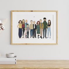 a group of people standing next to each other in a room with white walls and a wooden table