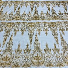 Turn heads with this exquisite Beaded & Corded Bridal Lace Fabric Embroidered on 100% Polyester Net Mesh. Beautifully crafted and adorned with pearls, sequins and beads, this special fabric is perfect for adding a glamorous and luxurious touch to your wedding dress, evening gown, quinceanera dress and any other dance costumes or special occasion outfits. You'll feel like a princess when you step out wearing this amazing Corded Couture Lace, Beaded Couture Lace, Beaded Bridal Lace, Beaded Evening Gold Floral Embroidered Fabric For Ceremony, Gold Pearl Embroidered Fabric For Reception, Gold Floral Embroidered Fabric For Reception, Festive Gold Embroidered Fabric With Pearl Details, Festive Gold Fabric With Pearl Embroidery, Gold Embellished Embroidered Fabric For Ceremony, Elegant Gold Fabric With Embroidered Border, Luxury Gold Fabric With Intricate Embroidery For Ceremonies, Gold Embroidered Fabric For Festive Ceremony