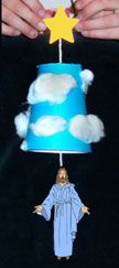 a person is holding a paper lamp with clouds and a star on it