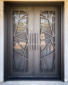 an ornate iron door with glass panels on the front and side doors are shown in black