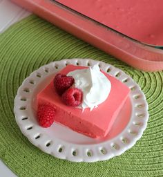 a slice of raspberry cheesecake on a plate