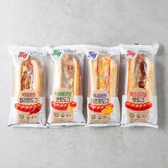 three packages of hot dogs are lined up