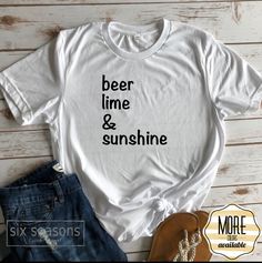 Beer Lime and Sunshine Are you looking for the perfect summer shirt? You will Love this fun shirt from the six seasons shop Summa Time is here!! Cheers! You will fall in love with how soft our t-shirts are. Our Unisex shirts are a little longer in length so you can throw it on over a pair of your favorite leggings and you're ready to go! They also make for great layering shirts. Our shirts are professionally made by our little family right here in the USA! Sizing: (This shirt has a unisex fit. W Layering Shirts, Funny Vacation Shirts, Funny Vacation, Six Seasons, Vacation Humor, Boat Shirts, Girls Trip Shirts, Cruise Shirt, Layered Shirts