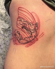 a woman with a tattoo on her stomach has a drawing of a man riding a surfboard