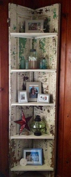 an old book shelf with pictures on it