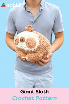 a person holding a crocheted stuffed animal in their hands with the caption giant sloth crochet pattern