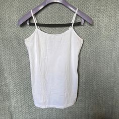 Plain White Tank Top. Never Worn ! Let’s Repurpose It . Fits Like A Women’s Small. Basic White Stretch Camisole, White Stretch Basic Camisole, Basic White Camisole Top, White Stretch Camisole Casual Style, Basic White Cami Top, Basic White Camisole For Spring, White Basic Camisole For Spring, Casual Solid Color Cotton Camisole, White Cotton Camisole Tops