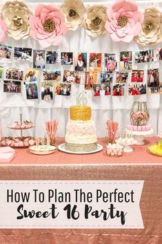 a table topped with cake and pictures next to a wall covered in pink paper flowers