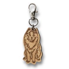 a wooden keychain with a dog on it