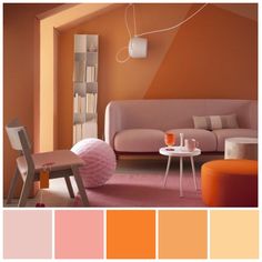 a living room with orange, pink and white colors in the color scheme for the walls