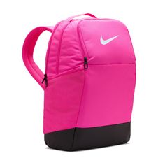 Grab your gear and get going with the Nike Brasilia Backpack. It has plenty of pockets to help you stay organized, including a sleeve to fit your laptop, side mesh pockets for water bottles, and a zippered pocket on the inside to keep small items secure. This product is made with at least 50% recycled polyester fibers. Haul loop at the top. Spacious main compartment. Padded, adjustable shoulder straps. Front zip pocket. Internal laptop sleeve. Dimensions: 18" H x 12" W x 7" D. Capacity: 24 L. Sh Pink Nylon Gym Bag For Outdoor, Pink Nylon Backpack For Daily Use, Pink Nylon Bags For Outdoor, Pink Nylon Outdoor Backpack, Pink Nylon Outdoor Bag, Nike Nylon Backpack For Outdoor Activities, Nike Functional Backpack For Outdoor Activities, Nike Nylon Standard Backpack, Pink Standard Backpack For Outdoor