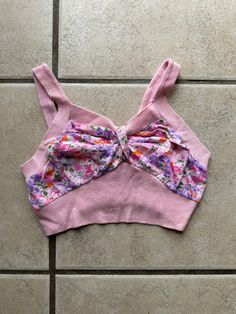 This vintage 70's crop top is pink floral with solid pink straps and chest band. It is a girls large or women's XXS.  It is in good condition there are a couple stains in back on the pink band as shown in pictures.  Please go by the measurements below for actual sizing. Chest no pull-28 inches Chest with pull-34 inches Rib cage no pull-22 inches Rib cage with pull-26 inches  Top of V to bottom of chest band-9 inches Back band width-4.5 inches 12.5 inches from top of strap to bottom hem To see mo Floral Halter Top, Womens Halter Tops, Halter Tops, Rib Cage, The Pink, Vintage Pink, Vintage 70s, Halter Top, Womens Clothing Tops