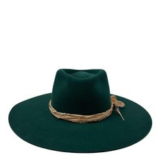 The montana fedora is made from a lite stockman felt and had a slightly rounder crown. There is no movement in the felt so please size accordingly Trimmed with vintage silks and a feather ,this emerald color is a deep and rich pop of color for your everyday. Made in the USA . 4" brim. ADD custom embroidery for your own look! exchange or site credit only small 21-22 inch circ medium 22-23 inch circ large 23-24 inch circ