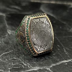 Embroidered Surah Al-Inshirah Silver Ring, Silver Islamic Turkish Handmade Ring , Arabic Writing Thumb Ring , Ottoman Style , Gift For Him , Same Day For Shipping ✧ Product Details * Handmade İtem * Gender : Male / Female * Material : 925K Sterling Silver * Ring Weight : 19 Grams * Gemstone Type : Green Zircon ✔ Usage Details * Silver jewelry is very sensitive to chemicals. It is recommended to keep away from chemical substances such as cream, bleach, deodorant, detergent. * Silver jewelry can also darken quickly in salt water, that is, in sea water. For this reason, it is best to remove them when swimming in the sea. ✔ Shipping * Your orders placed on weekdays are delivered to the cargo on the same day. Your orders placed on the weekend are delivered to the cargo on Monday. ✔ Other Detail Gold Emerald Ring Hand Set As A Gift, Traditional Silver Signet Ring For Ceremonial Use, Traditional Handmade Signet Ring For Ceremonial Use, Bohemian Engraved Ring As Gift, Bohemian Engraved Ring As A Gift, Traditional Silver Signet Ring With Intricate Design, Ceremonial Spiritual Engraved Ring With Intricate Design, Traditional Ceremonial Engraved Ring With Intricate Design, Traditional Handmade Round Signet Ring