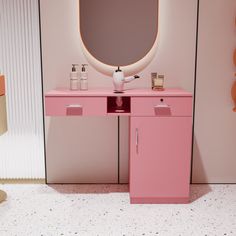 there is a pink vanity and mirror in the room with it's lights on