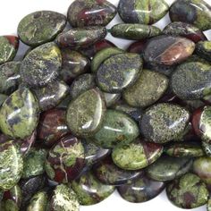 green and brown rocks with moss on them