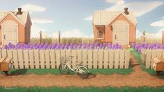 there is a bike parked in front of a picket fence with purple flowers on it