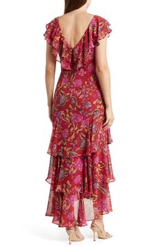 Cascading tiers of ruffles add a touch of elegance to a woven dress patterned with blooming flowers. Back zip closure V-neck Short sleeves Lined 100% polyester Machine wash, line dry Imported