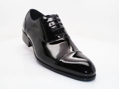 Style: 505-101P-Black Exclusively for C & E Shoes, this Elegant Patent Leather lace-up Oxford from the Carrucci collection features a cap-toe and a clean welt! Black Cap Toe Lace-up Shoes For Office, Classic Black Oxfords With Laces, Black Patent Leather Cap Toe Lace-up Shoes, Elegant Black Leather Shoes With Laces, Black Oxfords With Almond Toe And Laces, Elegant Black Oxfords With Laces, Black Almond Toe Oxfords With Laces, Black Cap Toe Oxfords With Rubber Heel Cap, Formal Black Lace-up Shoes With Rubber Heel Cap