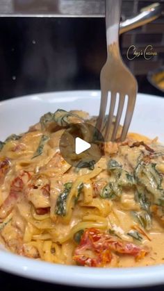 a fork is stuck into a pasta dish