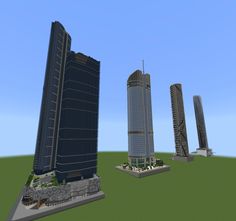 some very tall buildings in the middle of a green field