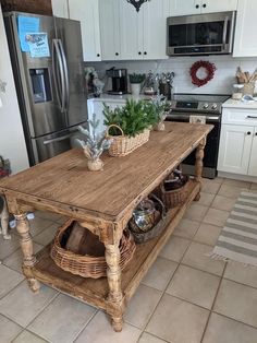 a kitchen island with baskets on top of it