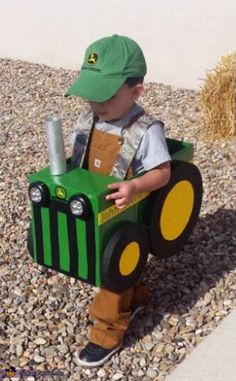 a little boy dressed up as a tractor