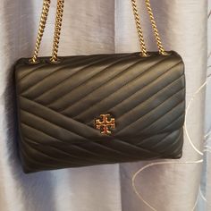 Excellent Condition Tory Burch Kira Chevron Convertible Shoulder Bag, Used Once, Clean Inside And Out With Dust Bag. Quilted Leather Crossbody Detailed With Stacked-T Logo Hardware And A Gleaming Chain Strap. A Spacious Interior With Plenty Of Pockets. Retail Price $595+Tax 11"W X 7 ½"H X 3 ½"D 13" Strap/ 24" Crossbody Strap Drop Designer Double Flap Bags For Everyday Use, Shopping Bag With Removable Pouch And Double Flap, Double Flap Shoulder Bag With Dust Bag For Travel, Travel Double Flap Shoulder Bag With Dust Bag, Double Flap Satchel For Everyday Use, Double Flap Shoulder Bag With Dust Bag, Leather Double Flap Bags For Shopping, Chic Double Flap Satchel For Shopping, Double Flap Satchel For Shopping