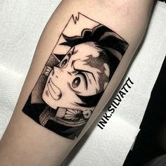 a man's arm with an anime character tattoo on the left side of his arm