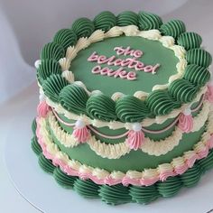 a green and pink cake with the words, the belcange duke on it