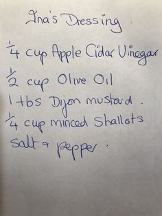 an apple cider vinegar recipe written in blue ink on a white piece of paper