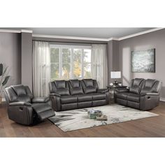 a living room filled with furniture on top of a hard wood floor covered in gray walls