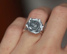 Silver rose made of polymer clay. Material of band- sterling silver Floral ring with sculpted flower EACH PETAL MADE BY HAND Dia rose about 15 mm/ 0,59 inch THE BASE IS ADJUSTABLE: sterling silver 925 base 5.5-8 or 7-9 size The ring is adjustable and can fit any size by gently pushing together the ends, overlapping them or gently pulling them apart. Before sending I will place this ring in small box ♥All my rings come in boxes.. If you are purchasing a gift I will wrap the box in tissue paper .I Rose Jewelry With 3d Flowers For Gift, Silver Flower Ring With Rose Design, Silver Flower Ring With Roses For Gift, Silver Wedding Ring With Roses, Silver Flower Ring With Roses For Wedding, Silver Jewelry With 3d Flowers For Gift, Silver Rose Ring Jewelry, Adjustable Silver Jewelry With Rose Details, Ring Polymer Clay